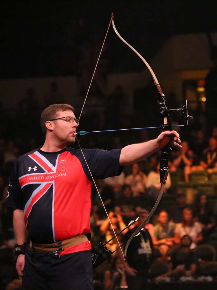 Paralympic athlete from the United-Kingdom team doing archery