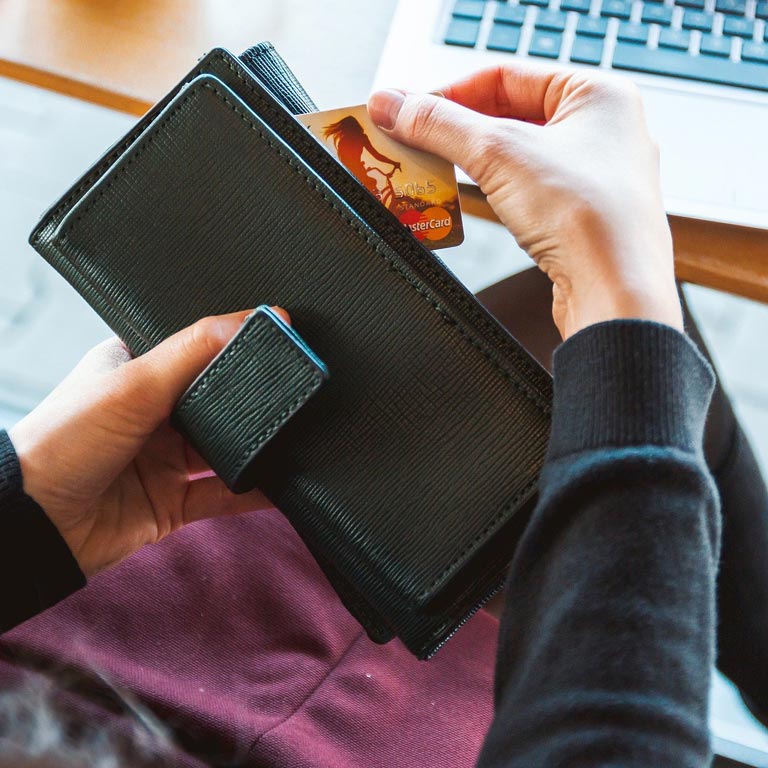 A person holding a wallet